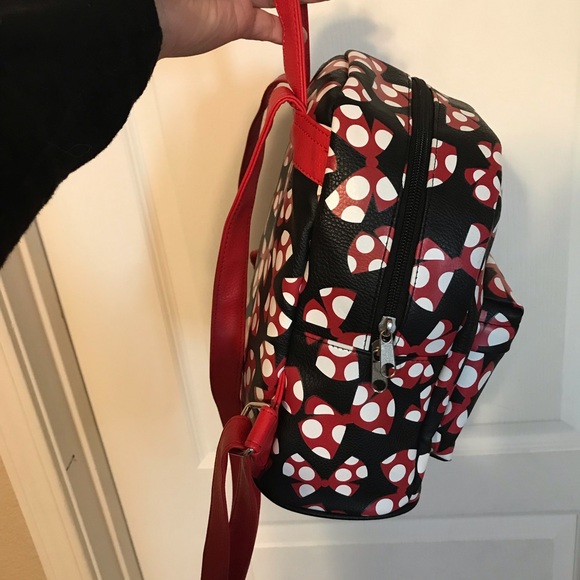 A beautiful Mini Disney Backpack with one packet outside. - Picture 6 of 9